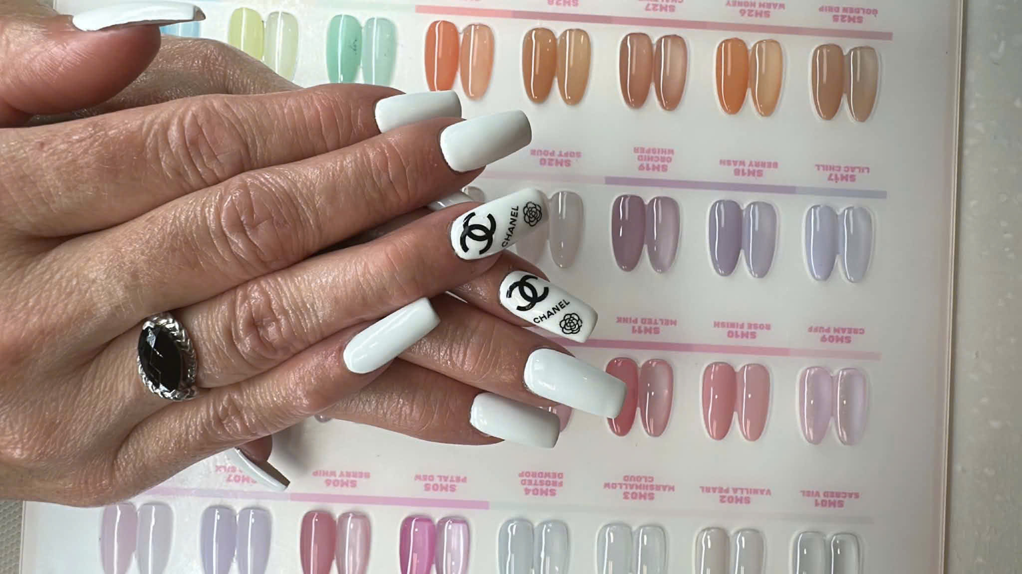 White logo nails landscape