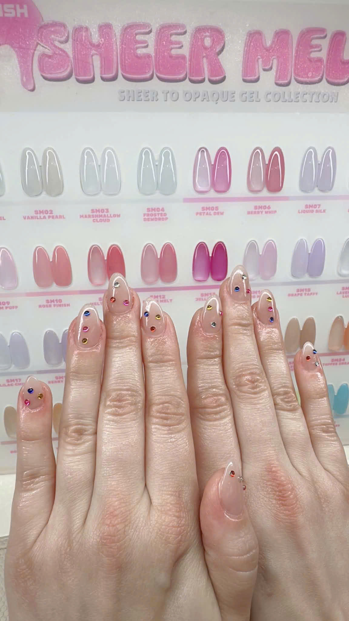 Gem accent nails over sheer palette