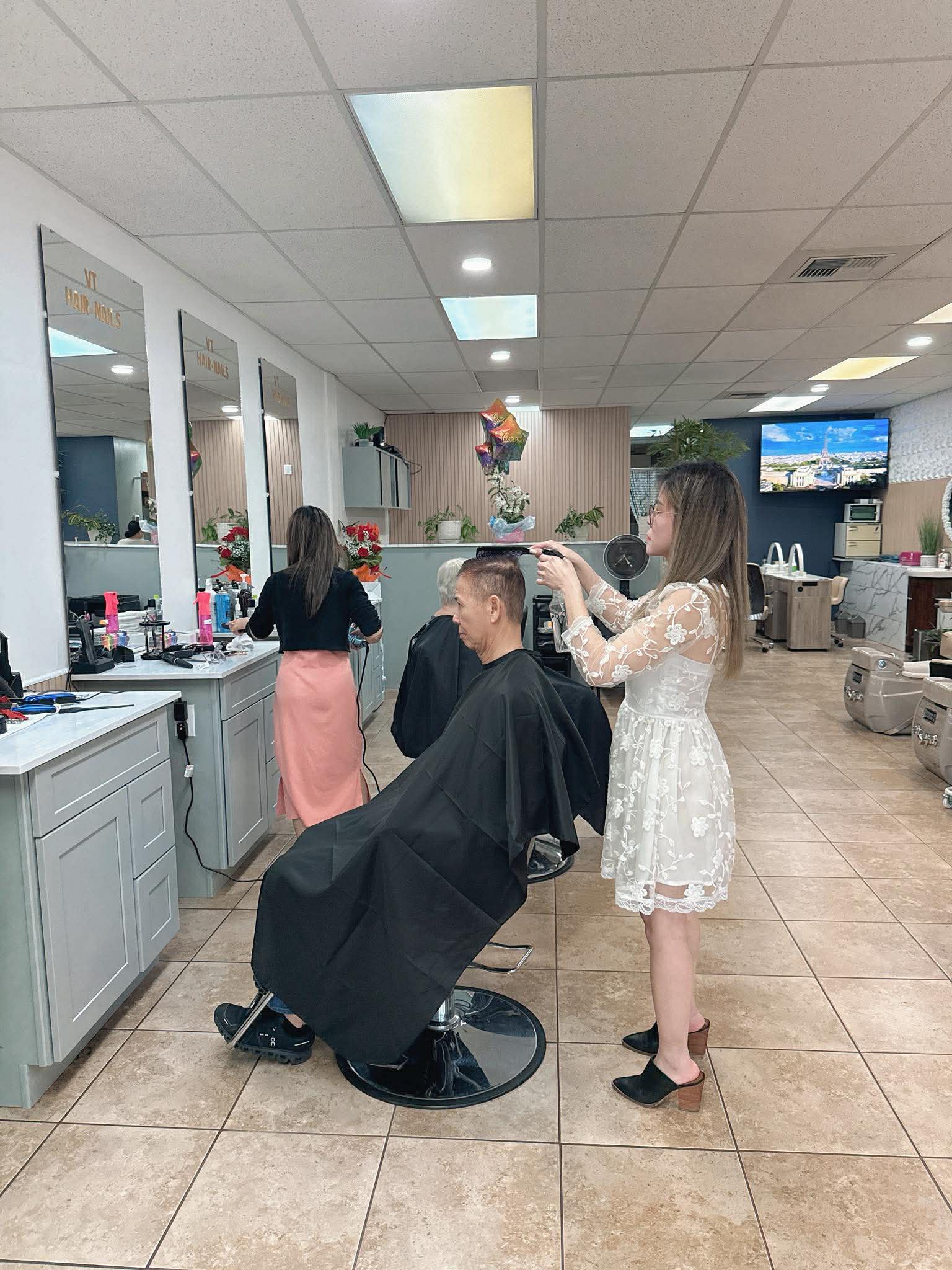 Haircut in progress on the salon floor